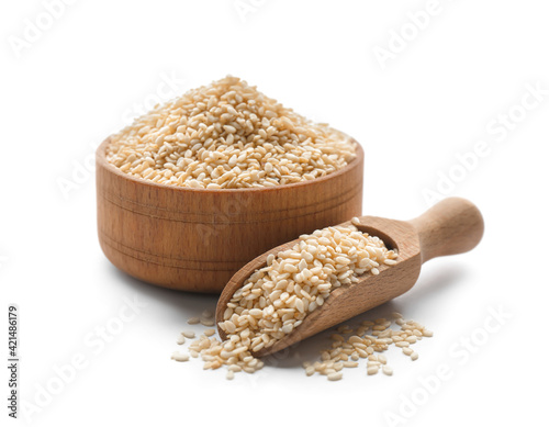 Photography Wooden bowl and scoop with sesame seeds on white background