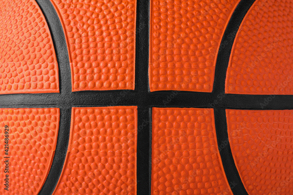 Fototapeta premium Orange ball as background, closeup. Basketball equipment