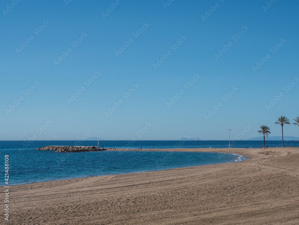 View of Puente Romano beach, Marbella. Malaga Province, Spain. It can be seen Gibraltar and Atlas Mountain