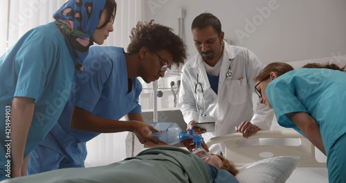 Young future doctors learning to reanimate patient in emergency department