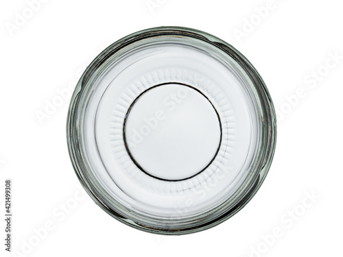 Empty transparent glass jar without a lid. Isolated on a white background. Close-up, top view