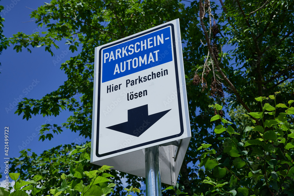 German sign, the words are meaning in English: parking ticket machine, buy parking ticket here