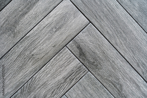 Ceramic tiles of rectangular shape in gray with wood texture. Close-up. Flat lay frame