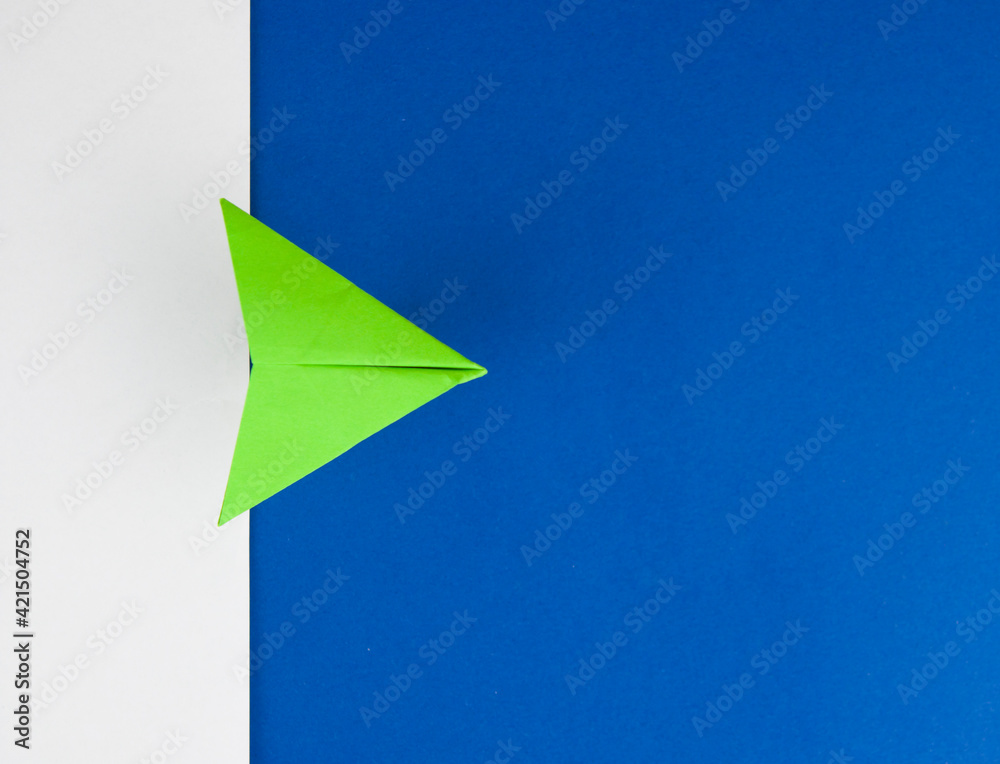 Travel concept with paper plane on white and blue paper background Travel concept with paper plane on white and blue paper background