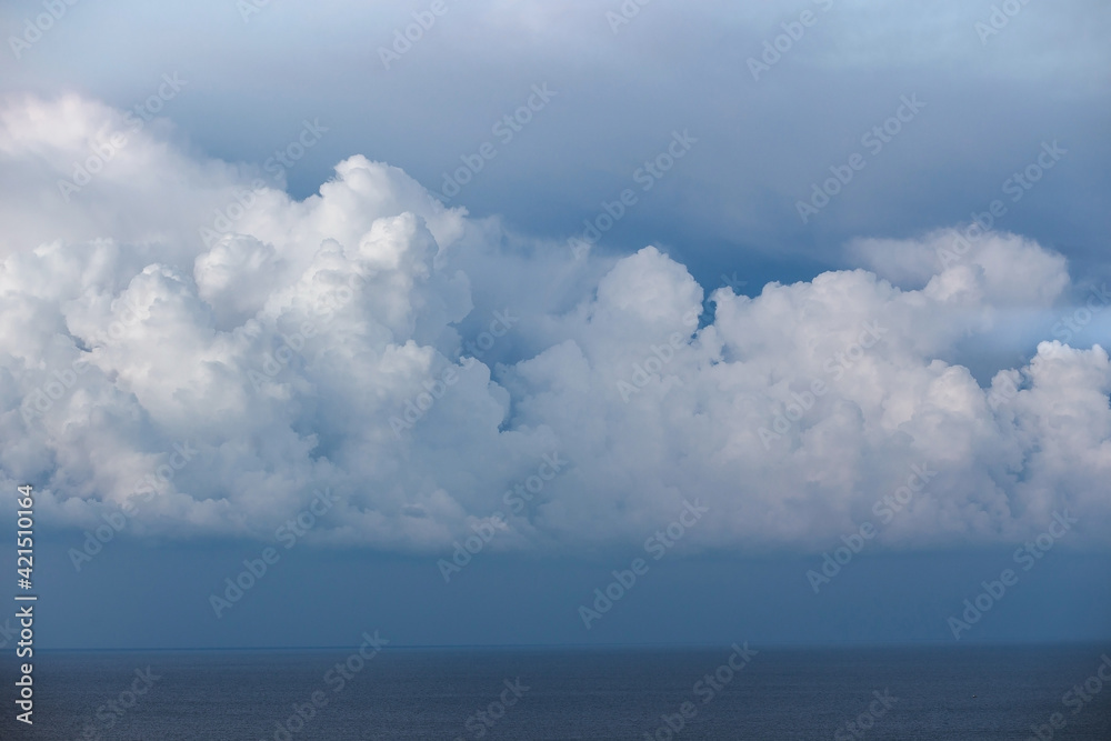 Cumulus storm clouds over the sea, weather forecast, atmospheric front