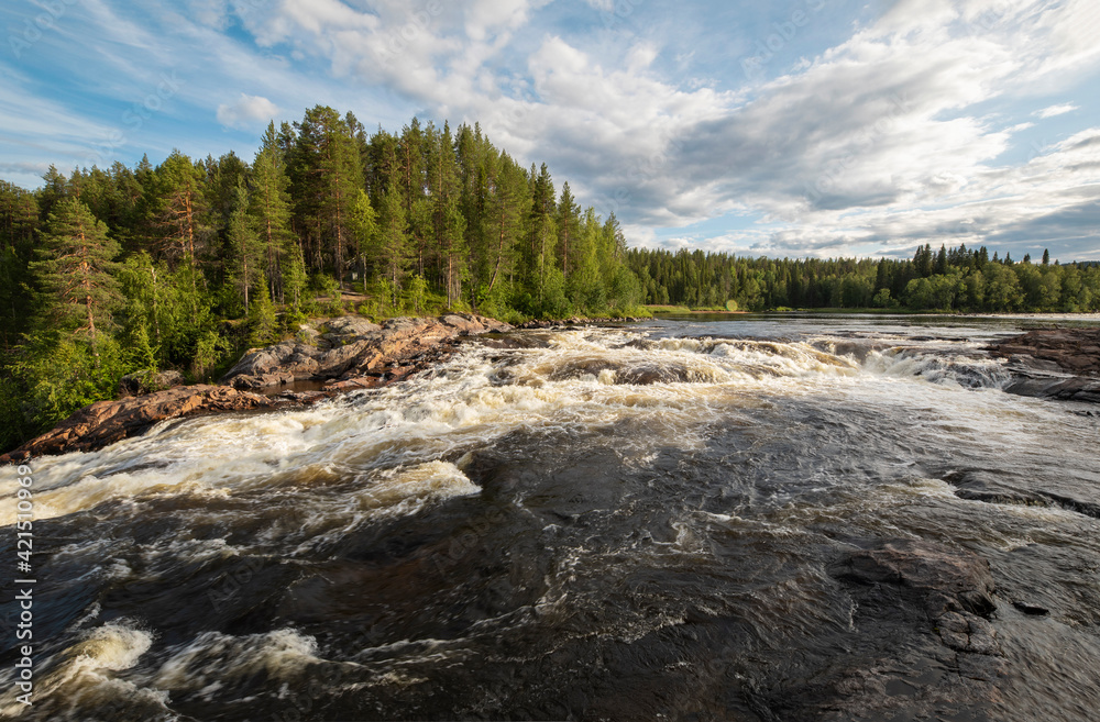 Blue spring sky over forest and fast river Blue spring sky over forest and fast river
