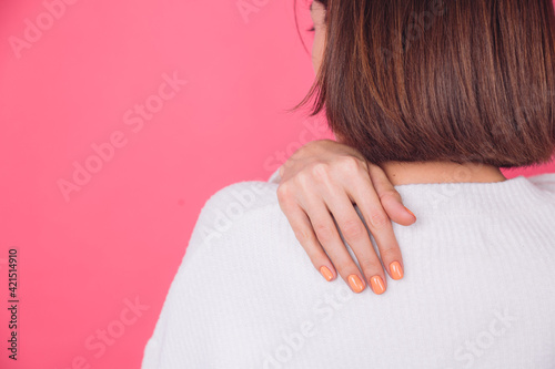 Wallpaper Mural close frame of woman's hands with orange manicure on white sweater and pink background isolated copy space Torontodigital.ca