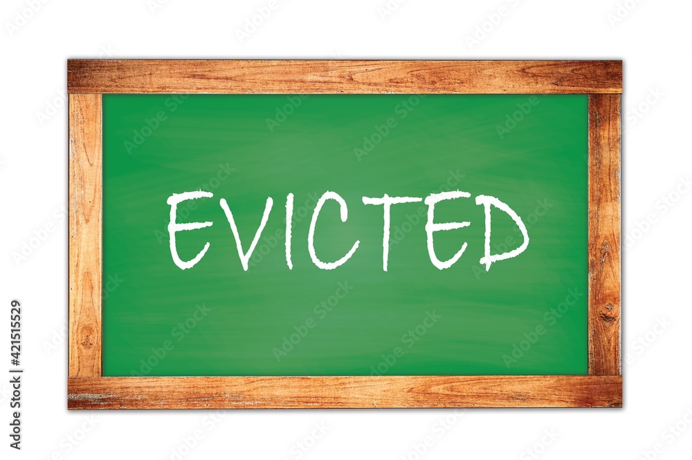 EVICTED text written on green school board. EVICTED text written on green school board.
