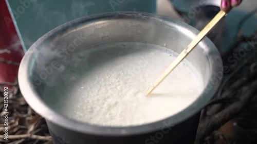 Making kheer on stove in Rural area before chhath puja photo