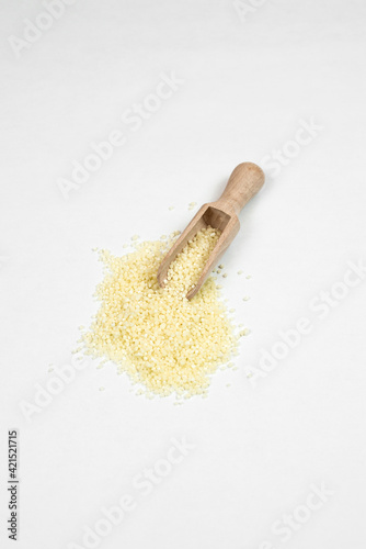 a handful of sorghum on a white background. healthy food. vegetarianism 