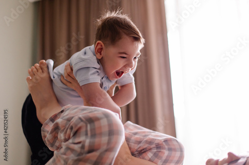 mom of special child plays with him. family with child cerebral palsy lives a normal life. Small moments of happiness real life. Disabled kid toddler laughs smiles. Love caring support.  Lifestyle