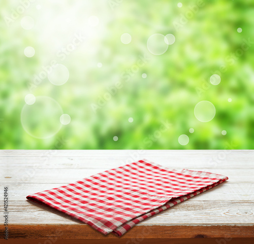 Napkin. Tablecloth tartan, checkered, dish towels on wooden table perspective. Summer background.
