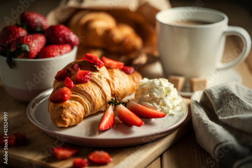 delicious golden croissants filled with strawberry marmalade