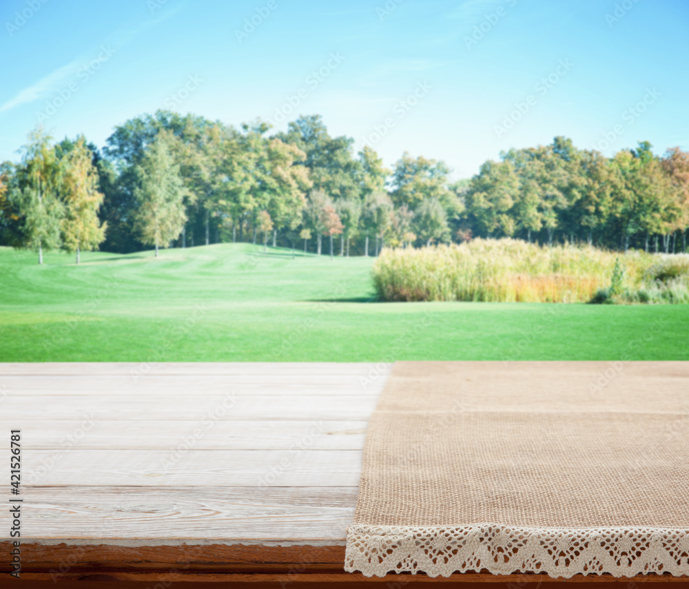 Napkin. Tablecloth tartan, checkered, dish towels on wooden table perspective. Summer background. Napkin. Tablecloth tartan, checkered, dish towels on wooden table perspective. Summer background.