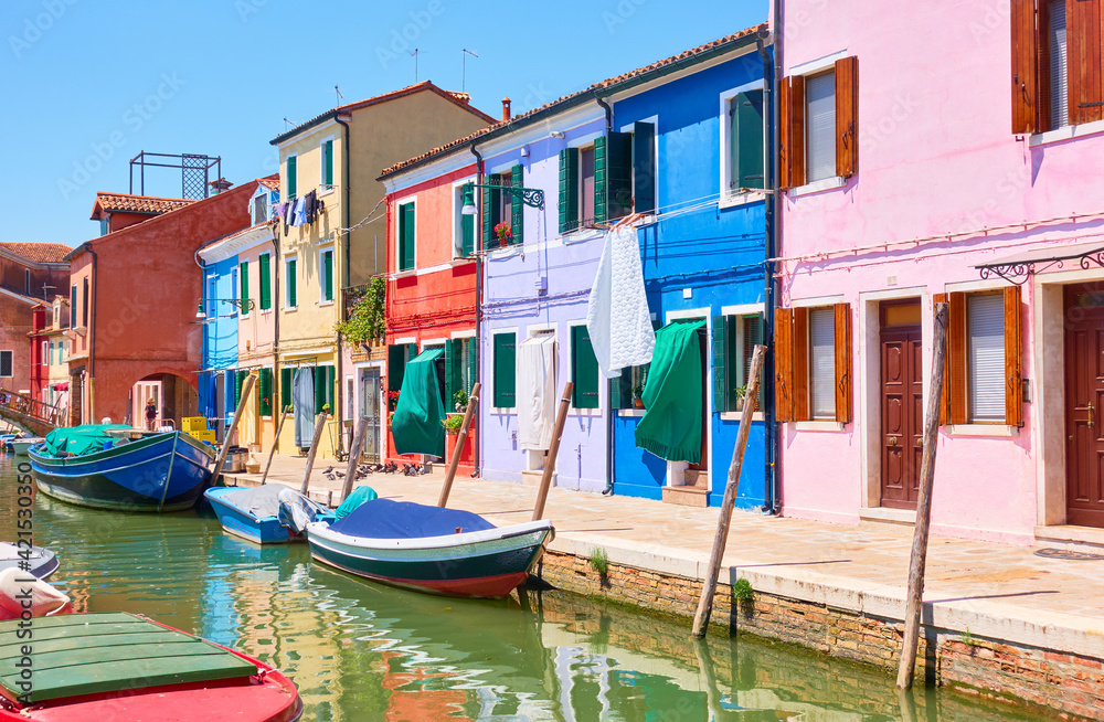 Colorful buildings bu canal in Burano in Venice