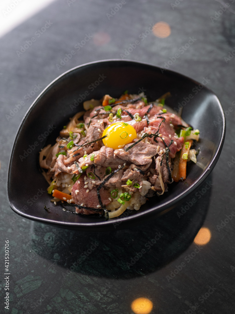 Japanese Menu - Gyudon in the bowl with eggyolk Japanese Menu - Gyudon in the bowl with eggyolk