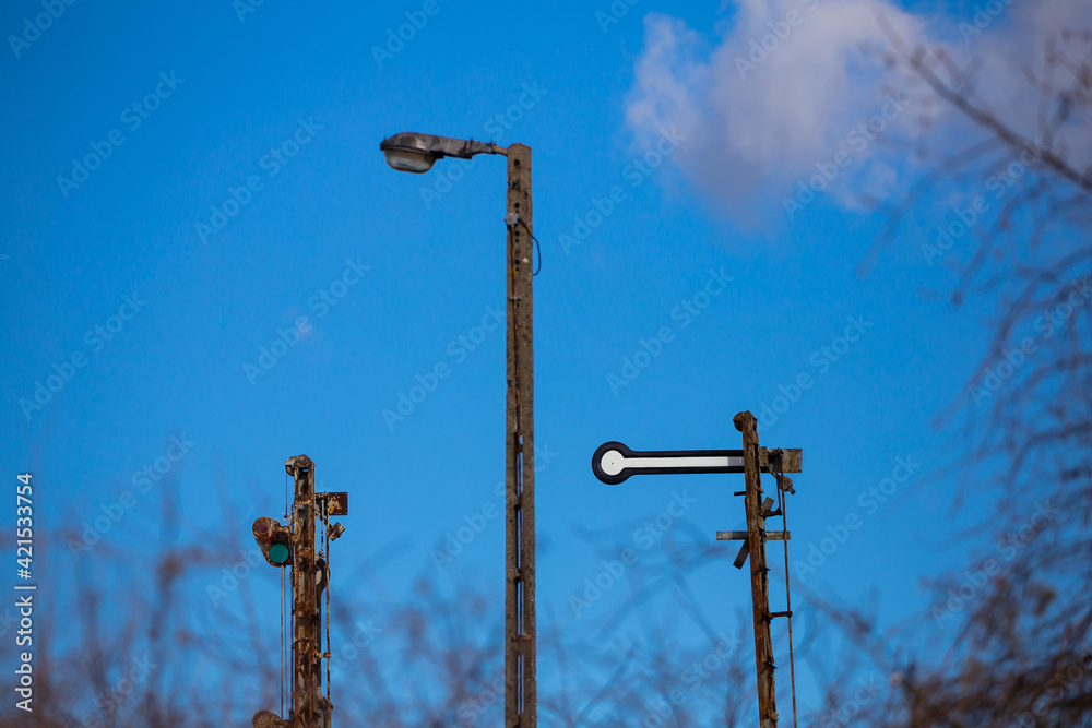 Old railway semaphores against the blue sky background. Taken on a sunny day Old railway semaphores against the blue sky background. Taken on a sunny day
