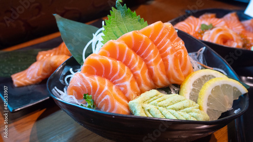Japanese Menu - Salmon Sashimi served with wasabi and lemon