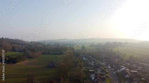 Drone flight over lyminge town with blue sky photo