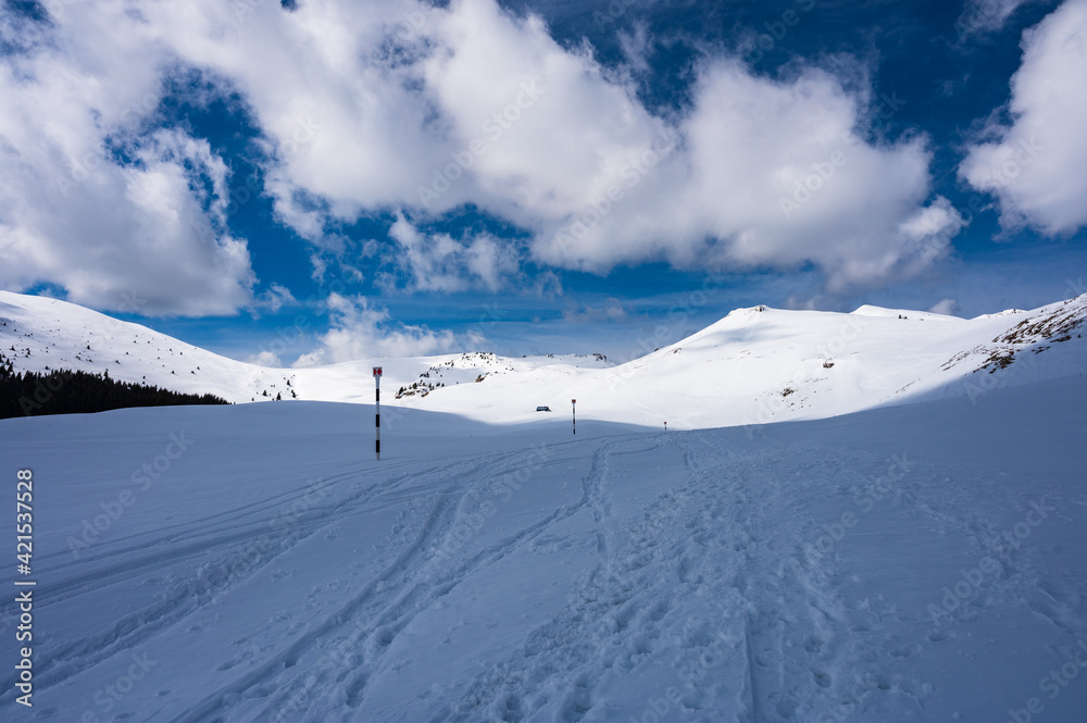 Snowy hiking trail in Romanian Carpathians in winter