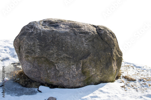 natural stone in the snow isolated on white phonen photo