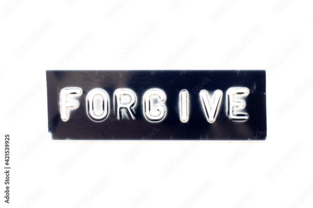 Embossed letter in word forgive on black banner with white background Embossed letter in word forgive on black banner with white background