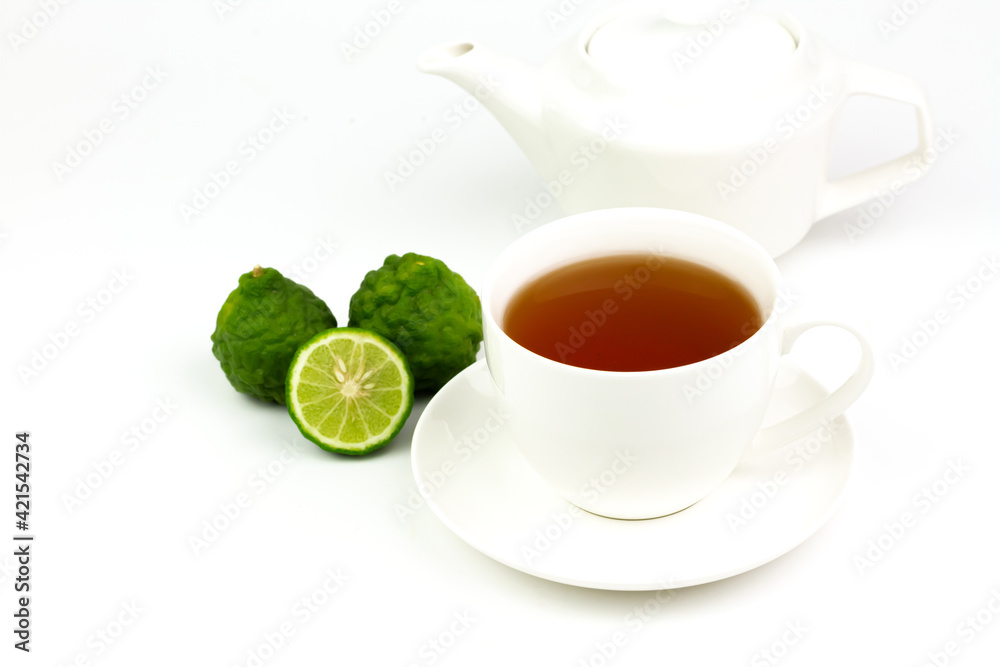 Bergamot tea in white ceramic cup and fresh bergamot fruit and sliced isolated on white background. Bergamot tea in white ceramic cup and fresh bergamot fruit and sliced isolated on white background.