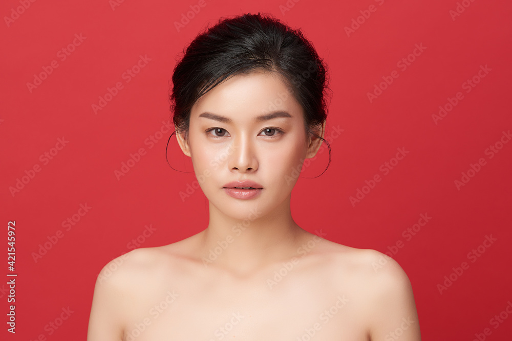 Beautiful young asian woman with clean fresh skin on red background, Face care, Facial treatment, Cosmetology, beauty and spa, Asian women portrait Beautiful young asian woman with clean fresh skin on red background, Face care, Facial treatment, Cosmetology, beauty and spa, Asian women portrait