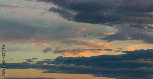 Sunset sky with dramatic clouds. Natural background.