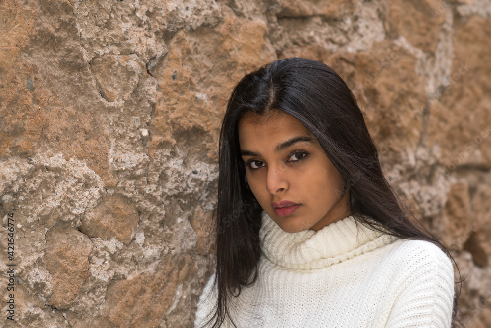 Close up portrait of a beautiful attractive young woman looking at the camera
