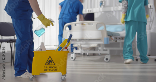 Medical staff doing disinfection and cleaning in intensive care unit of clinic