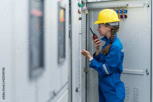 A female electrical engineer feeling unhappy during inspecting work in the electrical control room ,Industrial quality work business concept