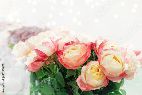 Two-tone romantic roses. Floral background with soft focus. A bouquet of roses on the counter in a flower shop. copy space