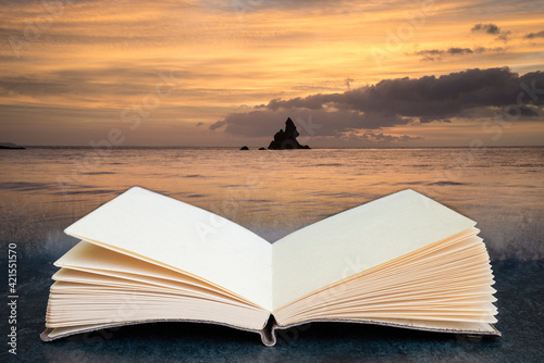 Beautiful sunrise landsdcape of idyllic Broadhaven Bay beach on Pembrokeshire Coast in Wales coming out of pages of conceptual book photo