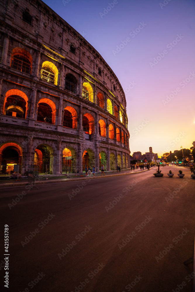 Exterior view of Colosseum at dusk in Rome city