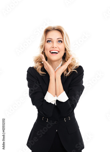 Happy gesturing young cheerful businesswoman in black suit, isolated over white background. Portrait of confident business woman at studio.