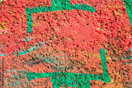 texture of a red and green wall covered with with torn old paper and plaster  style grunge  space for text  space for copy