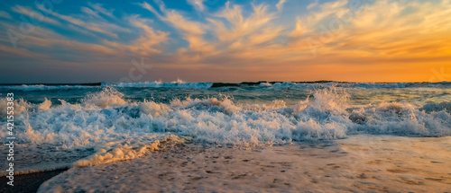 Sunset seascape along the sandy beach of Yzerfontein, Western Cape photo