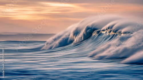Early morning waved at sunrise in Victoria Bay, Western Cape