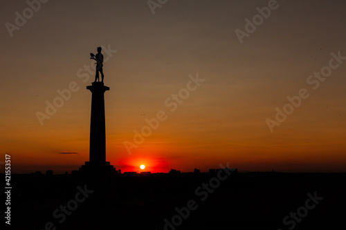 Silhouette of Belgrade Fortress with The Victor monument during sunset