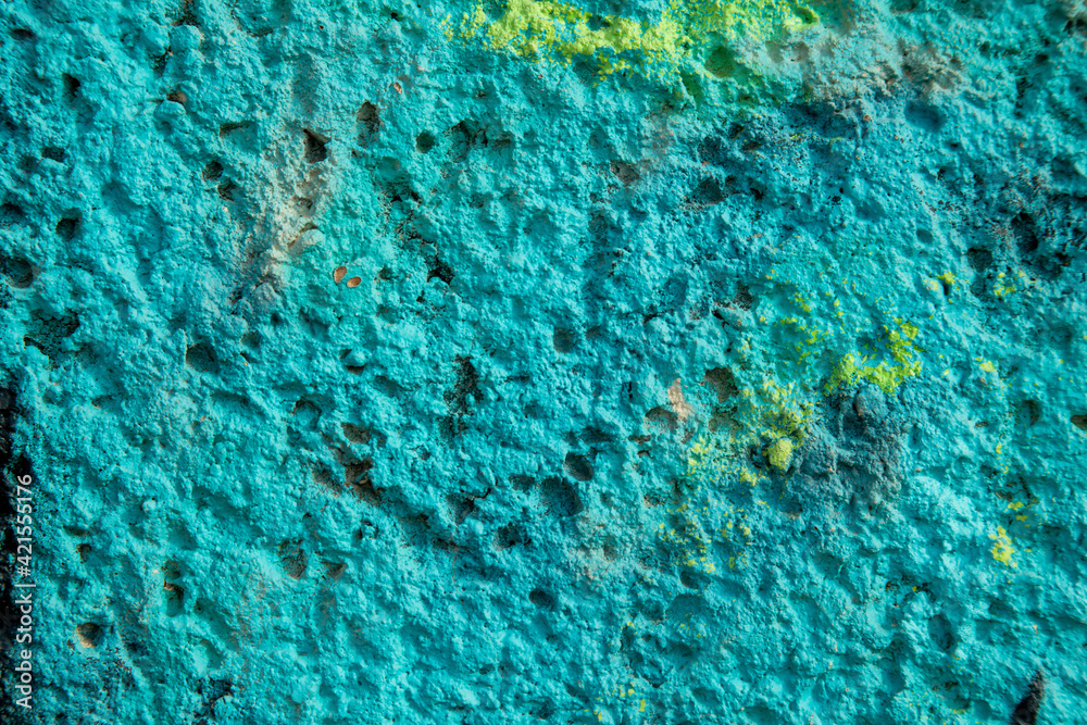 Obraz premium texture of a green wall covered with with torn old paper and plaster, style grunge, space for text, space for copy