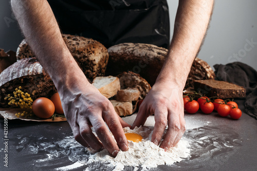 Man prepares dough for bread, gluten-free and without animal products. bread, gluten-free and without animal products.