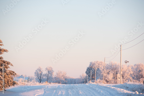 country gravel road in winter with snow