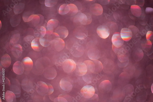 Pink bokeh blured background glitter blur celebration happy new year 2021 2022 and 2023 christmas bright lights on the dark background
