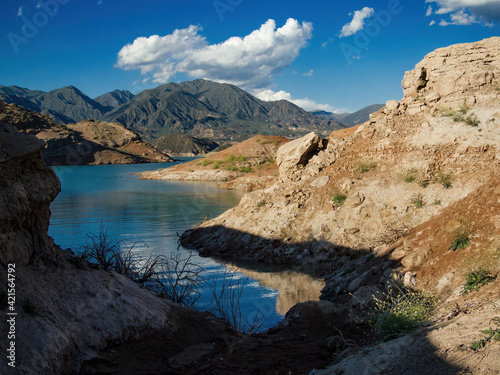 Potrerillos dam with mountains in the background during a sunny day. 