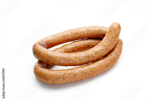 Rings of aromatic, country style, smoked sausage, isolated on a white background. Traditional meat product , a packshot photo for package design, template. Polish sausage, close-up.