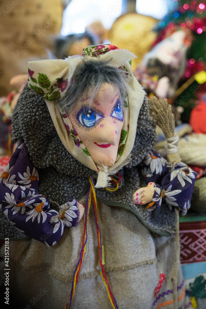 fabric souvenir in the shape of a grandmother with large eyes