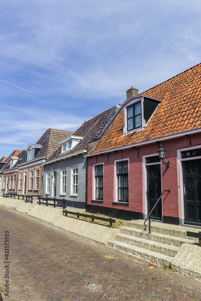 Colorful traditional houses in the small village Holwerd, Netherlands