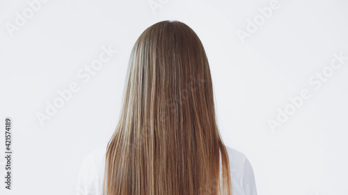 back view of woman with shiny long hair isolated on white
