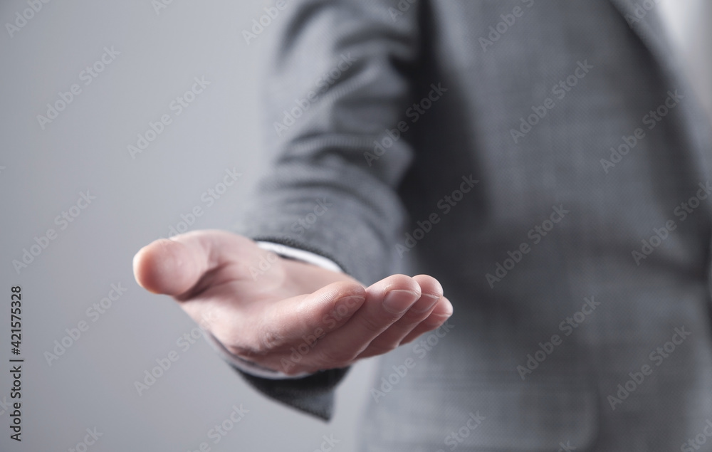 Fototapeta premium Caucasian businessman showing empty hand.